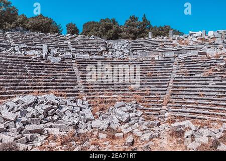 Ancient ruins of a famous amphitheater in the ancient city of Termessos. Travel destinations of Antalya region and Turkey. Stock Photo