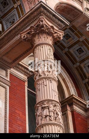 Exhibition Road facade of V&A (Victoria and Albert Museum), South Kensington, London; architectural details of people, grotesques on pillars Stock Photo