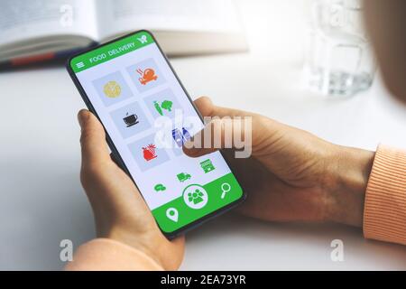 woman using mobile phone app to order food delivery Stock Photo