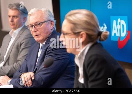 Stuttgart, Germany. 08th Feb, 2021. Bernd Gögel (M), leader of the AfD parliamentary group in the state parliament of Baden-Württemberg and top candidate for the state election, looks at Alice Weidel (r), state chair of the AfD Baden-Württemberg, during the presentation by the AfD Baden-Württemberg of its election programme and campaign for the state election in Baden-Württemberg on 14 March 2021. In the background sits Marc Jongen (AfD), member of the Bundestag and program coordinator of the Baden-Württemberg state executive committee. Credit: Sebastian Gollnow/dpa/Alamy Live News