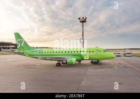 02 September 2020, Moscow, Russia: S7 Airplane at the parking space and routine maintenance work is being carried out with it. Stock Photo