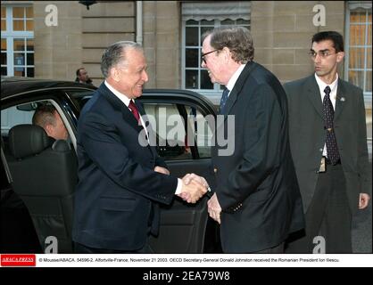 © Mousse/ABACA. 54596-2. Alfortville-France, November 21 2003. OECD Secretary-General Donald Johnston received the Romanian President Ion Iliescu. Stock Photo