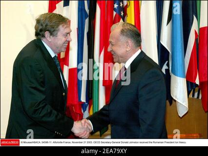 © Mousse/ABACA. 54596-11. Alfortville-France, November 21 2003. OECD Secretary-General Donald Johnston received the Romanian President Ion Iliescu. Stock Photo