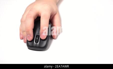 Isolated on a White Background. Male Hand Holds Wireless Computer Mouse on the Table. Click and Move Stock Photo