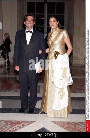© Serge Arnal/ABACA. 55836-1. Versailles-France, February 9, 2004. Minister of Education Luc Ferry and his wife Marie-Caroline attend the charity gala diner organised by Professor David Khayat for the profit of 'Association Vie Espoir contre le cancer' (French foundation against cancer) held at the Castle of Versailles. Stock Photo