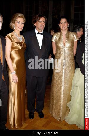 © Serge Arnal/ABACA. 55836-9. Versailles-France, February 9, 2004. Minister of Education Luc Ferry and his wife Marie-Caroline (R) and La Begum (L) attend the charity gala diner organised by Professor David Khayat for the profit of 'Association Vie Espoir contre le cancer' (French foundation against cancer) held at the Castle of Versailles. Stock Photo