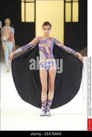A model displays a creation by designer Issey Miyake for his Spring ...
