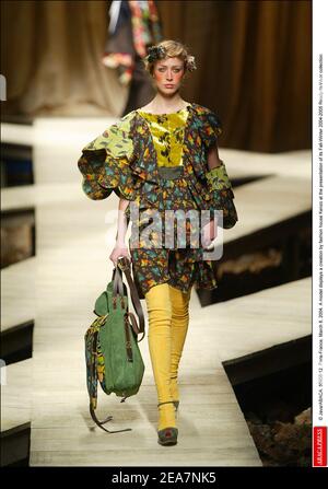 © Java/ABACA. 56908-12. Paris-France, March 8, 2004. A model displays a creation by fashion house Kenzo at the presentation of its Fall-Winter 2004-2005 Ready-to-Wear collection. Stock Photo