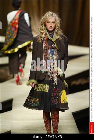 © Java/ABACA. 56908-5. Paris-France, March 8, 2004. A model displays a creation by fashion house Kenzo at the presentation of its Fall-Winter 2004-2005 Ready-to-Wear collection. Stock Photo