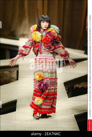 © Java/ABACA. 56908-11. Paris-France, March 8, 2004. A model displays a creation by fashion house Kenzo at the presentation of its Fall-Winter 2004-2005 Ready-to-Wear collection. Stock Photo