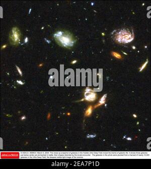© ABACA. 56999-4. March 9, 2004. This close-up snapshot of galaxies in the Hubble Ultra Deep Field reveal the drama of galactic life. It shows three galaxies just below center are enmeshed in battle, their shapes distorted by the brutal encounter. The galaxies in this photo were plucked from a harvest of nearly 10,000 galaxies in the Ultra Deep Field, the deepest visible-light image of the cosmos. Stock Photo