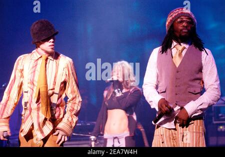 Taboo (Left) Fergie (Ctr) and Will.i.am of The Black Eyed Peas performing in support of their Elephunk release. Event held at the Warfield in San Francisco CA on March 29, 2004. (Pictured: Black Eyed Peas, Taboo, Fergie, Will.i.am) Photo by: Tim Mosenfelder/ABACA Stock Photo