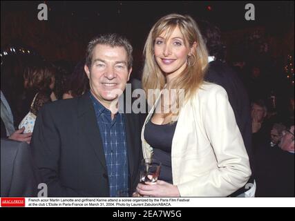 French actor Martin Lamotte and wife Karine Belly attend the party organized by the Paris Film Festival at the club L'Etoile in Paris-France on March 31, 2004. Photo by Laurent Zabulon/ABACA. Stock Photo