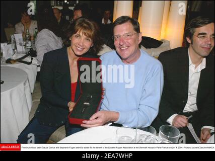 French producer Jean-Claude Camus and Stephanie Fugain attend a soiree for the benefit of the Laurette Fugain Association at the Denmark House in Paris-France on April 4, 2004. Photo by Laurent Zabulon/ABACA. Stock Photo