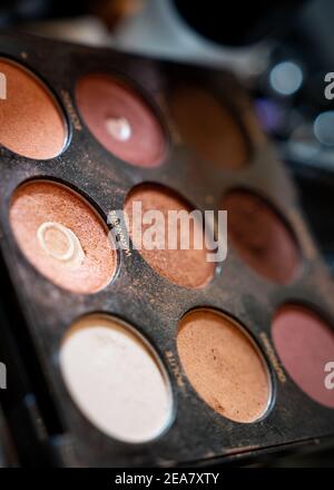 Eye shadow glitter makeup tray close up shot with the word Wannabe in sharp focus Stock Photo
