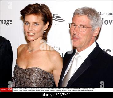 Richard Gere and his wife Carey Lowell as they walk the red carpet at the American Museum Of The Moving Image Salute to Richard Gere, held at the Waldorf Astoria hotel, in New York, on Tuesday, April 20, 2004. Photo by Nicolas Khayat/ABACA. Stock Photo