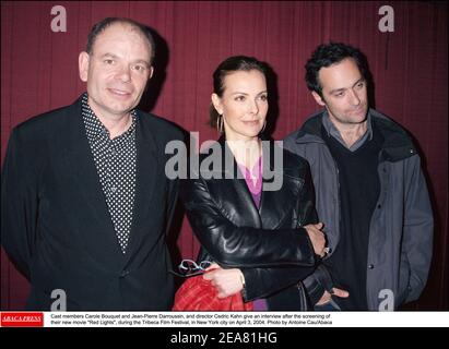 Cast members Carole Bouquet and Jean-Pierre Darroussin, and director Cedric Kahn give an interview after the screening of their new movie Red Lights, during the Tribeca Film Festival, in New York city on April 3, 2004. Photo by Antoine Cau/Abaca Stock Photo