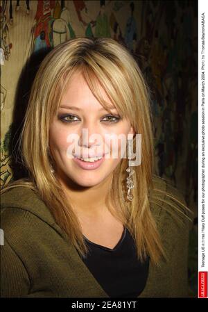 Teenage US actress Hilary Duff poses for our photographer during an exclusive photo session in Paris on March 2004. Photo by Thomas Beynon/ABACA. Stock Photo