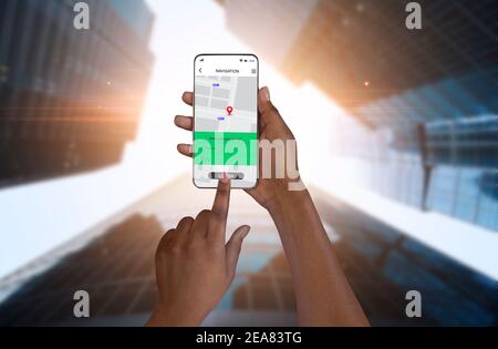 Phone With Navigator Application In Female Hands On Cityscape Background Stock Photo