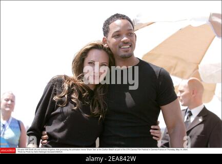 US actor Will Smith (R) and actress Angelina Jolie promoting the animation movie 'Shark Tale' at the Carlton Beach as part of the 57th Cannes Film Festival in Cannes-France on Thursday, May 14, 2004. Photo by Hahn-Nebinger-Gorassini/ABACA. Stock Photo