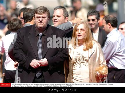 US director Michael Moore and his wife Kathleen Glynn pictured arriving at the screening of his documentary 'Fahrenheit 911' as part of the 57th Cannes Film Festival in Cannes-France on Sunday, May 16, 2004. Photo by Hahn-Nebinger-Gorassini/ABACA. Stock Photo