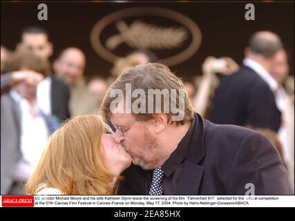 US director Michael Moore and his wife Kathleen Glynn leave the screening of his film 'Fahrenheit 911' selected for the official competition at the 57th Cannes Film Festival in Cannes-France on Monday, May 17, 2004. Photo by Hahn-Nebinger-Gorassini/ABACA Stock Photo