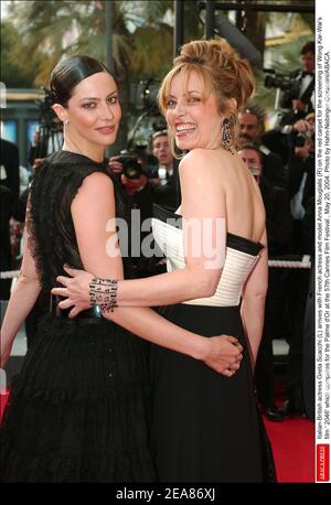 Italian-British actress Greta Scacchi (R) smiles as she arrives with French actress and model Anna Mouglalis (L) on the red carpet for the screening of Wong Kar-Wai's film ' 2046' which competes for the Palme d'Or at the 57th Cannes Film Festival , May 20, 2004. Photo by Hahn-Nebinger-Gorassini/ABACA. Stock Photo