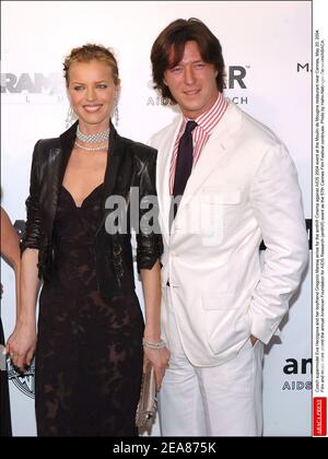 Czech supermodel Eva Herzigova and her boyfriend Gregorio Marsiaj arrive for the amfAR Cinema against AIDS 2004 event at the Moulin de Mougins restaurant near Cannes, May 20, 2004. Film and music stars attend the annual American Foundation for AIDS Research (amfAR) event as the 57th Cannes Film Festival continues. Photo by Hahn-Nebinger-Gorassini/ABACA. Stock Photo