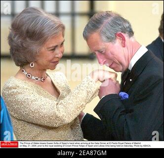 The Prince of Wales kisses Queen Sofia of Spain's hand when arriving at the Gala Dinner at El Pardo Royal Palace of Madrid on May, 21, 2004, prior to the royal wedding of Crown Prince Felipe of Spain and Letizia Ortiz being held on Saturday. Photo by ABACA. Stock Photo