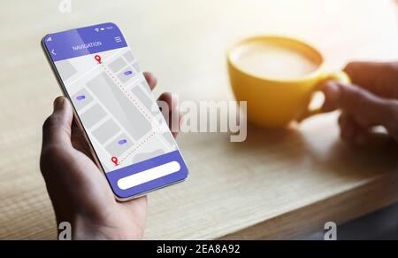 Closeup Of Smartphone With Mobile Navigation App In Male Hand Stock Photo