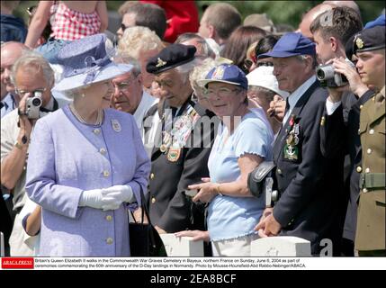 Britain's Queen Elizabeth II walks in the Commonwealth War Graves Cemetery in Bayeux, northern France on Sunday, June 6, 2004 as part of ceremonies commemorating the 60th anniversary of the D-Day landings in Normandy. Photo by Mousse-Hounsfield-Abd Rabbo-Nebinger/ABACA. Stock Photo