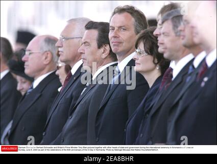 German Chancellor Gerhard Schroeder and Britain's Prime Minister Tony Blair pictured together with other heads of state and government during the international ceremony in Arromanches-France on Sunday, June 6, 2004 as part of the celebrations of the 60th anniversary of the D-Day in Normandy. Photo by Nebinger-Mousse-Abd Rabbo-Hounsfield/ABACA. Stock Photo