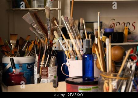 London - United Kingdom - December 23 2019 - Paintbrushes and other tools in an art studio. Stock Photo