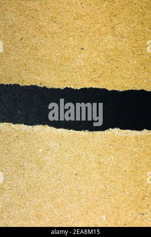 Torn Black Paper With Brown Background Stock Photo - Alamy