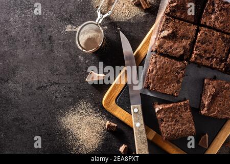 Homemade pieces of brownies on black background Stock Photo