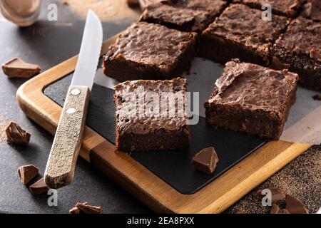 Homemade pieces of brownies on black background Stock Photo