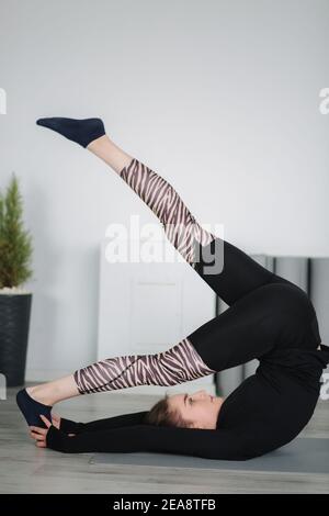 Young stretching master show differnt poses for stretch Stock Photo - Alamy