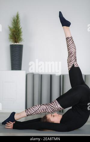 Young stretching master show differnt poses for stretch Stock Photo - Alamy