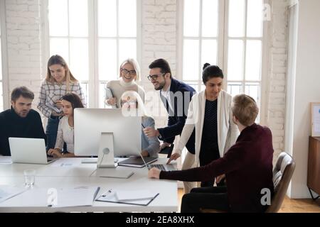 Diverse group of millennial professionals working on project Stock Photo