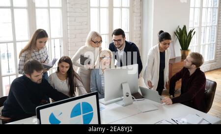 Marketing department team analyzing project reports Stock Photo