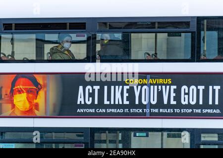 Edinburgh, Scotland, UK. 8 Feb 2021. Covid-19 government health advisory billboard on side of Edinburgh bus.  Iain Masterton/Alamy Live news Stock Photo