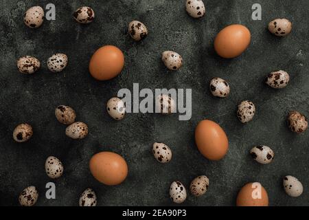 Stylish pattern with Easter eggs isolated on dark gray background. Flat lay, Top view. Easter holiday concept. Stock Photo
