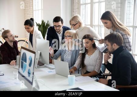 Big group of business people analyzing marketing reports Stock Photo