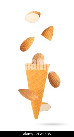 Flying almonds on white background. Food levitation concept. Stock Photo