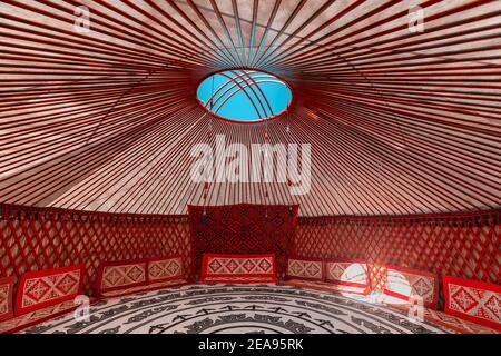 Interior of a Yurt. It is a portable tent house in the culture of Central Asian nomadic peoples. Ethnic and folk patterns for home decoration Stock Photo