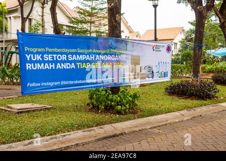 Jakarta, Indonesia - June 24, 2020: A banner encouraging plastic and waste recycling in an Indonesian Compound, Jakarta Indonesia. Translation 'Giv Stock Photo