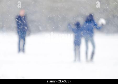Abstract figures in snowy landscape Stock Photo