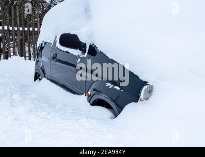 Car completely snowed in in the snow chaos Stock Photo
