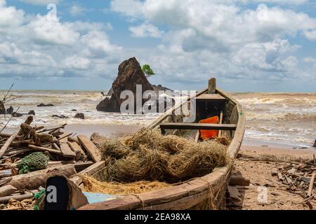 Fishing boat in a beautiful resort in Ghana Axim West Africa. An old fishing village that largely consists of fishing as the main industry. Stock Photo