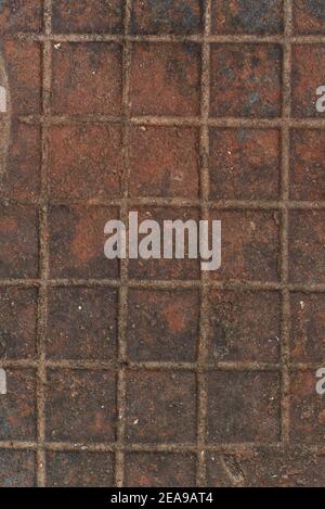 Old red ceramic tiles rusted aged square texture in suburban area Stock Photo